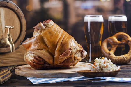 Pork knuckle, beer and pretzelsの写真素材