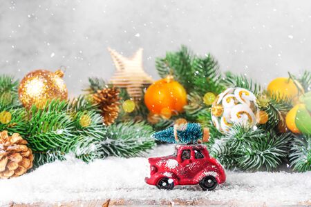 Christmas fir tree on a toy carの写真素材