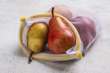 Fresh pears in eco bag, zero wasteの写真素材