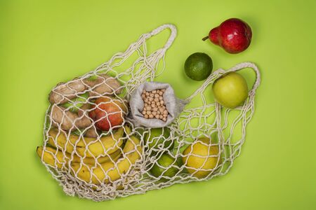 Zero waste string bag with fresh fruitsの写真素材