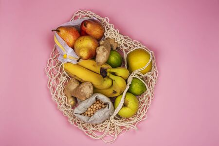 Zero waste string bag with fresh fruitsの写真素材
