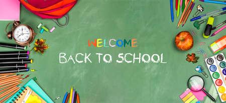School statonery on green blackboardの写真素材