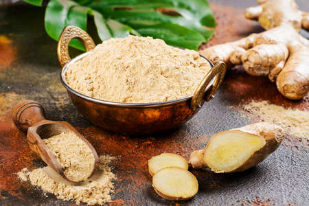 Ginger powder and fresh rootの写真素材