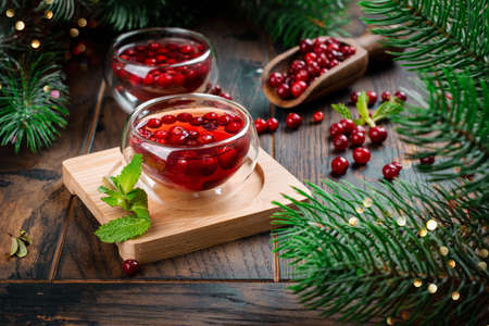 Hot cranberry tea on wooden tableの写真素材