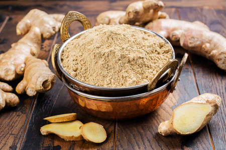 Ginger powder and fresh rootの写真素材