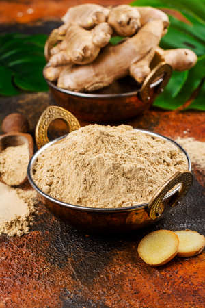Ginger powder and fresh rootの写真素材