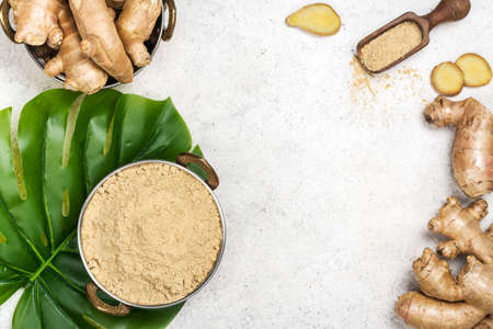 Ginger powder and fresh rootの写真素材