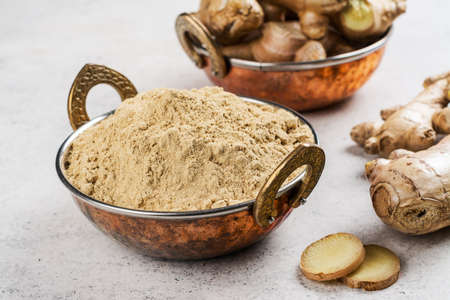 Ginger powder and fresh rootの写真素材