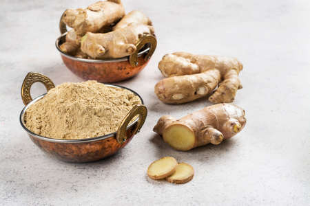 Ginger powder and fresh rootの写真素材