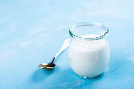 Greek yogurt in a glass jarの写真素材