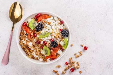 Cottage cheese with granola, berriesの写真素材