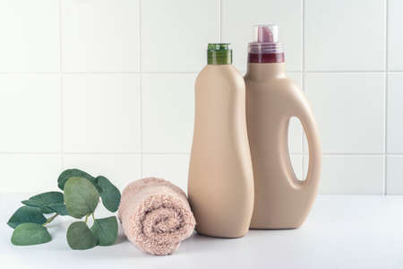 Bottle of detergent and clean towels