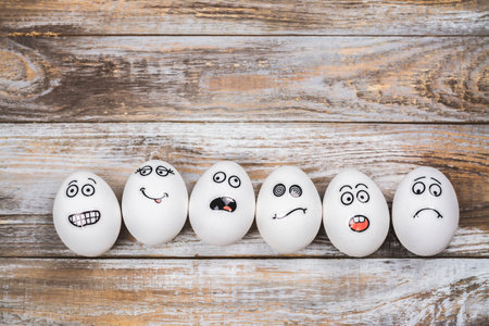Funny eggs with different mood facesの写真素材