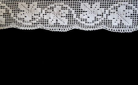 Handmade, white crochet, embroidery, on a black background, contrastの写真素材