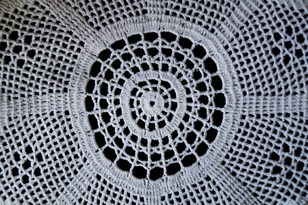 Handmade, white crochet, embroidery, on a black background, contrastの写真素材
