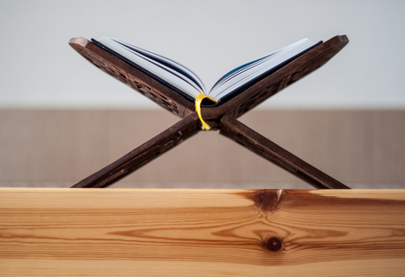 Quran-holy book of Muslims, an open book on a stand with rosaryの写真素材