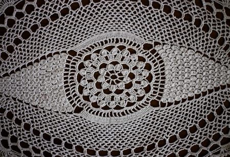 Handmade, white crochet, embroidery, on a wooden background, arts