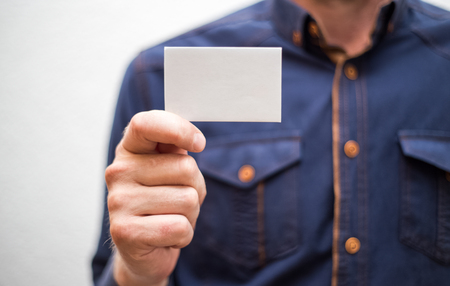 Bank card, business card, businessman holds card in hand, finances, jobsの写真素材