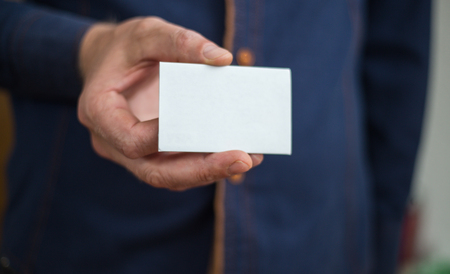 Bank card, business card, businessman holds card in hand, finances, jobsの写真素材