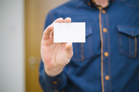 Bank card, business card, businessman holds card in hand, finances, jobsの写真素材