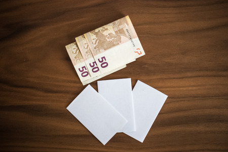 Bank cards, business cards, cash money on a wooden background, textureの写真素材