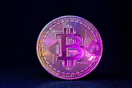 Golden bitcoin cryptocurrency with high value against currency and profitable mining.