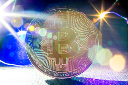 Golden bitcoin cryptocurrency with high value against currency and profitable mining.の写真素材
