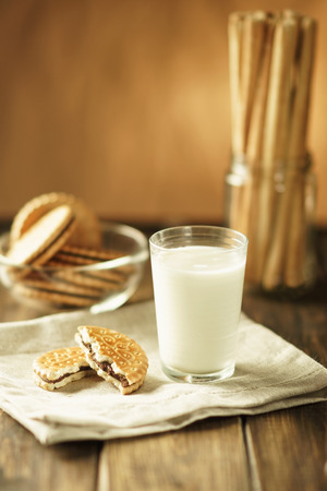 Cookies with glass of milk in rustic styleの写真素材