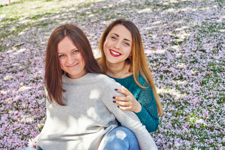 Two young woman in a parkの写真素材