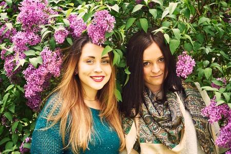 A female portrait with spring blossoming lilacの写真素材