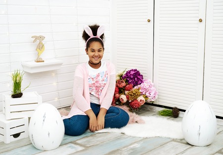 Studio shot of african girl with bunny ears
