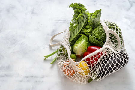 Top view of vegetables in reusable cotton net bag. Zero waste concept. Healthy foodの写真素材