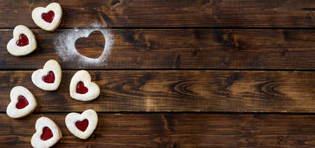 Heart shaped Linzer cookies for Valentines day on dark wooden backgorund. Copy spaceの写真素材