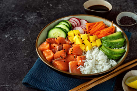 Close up of poke bowl with salmon, avocado and riceの写真素材