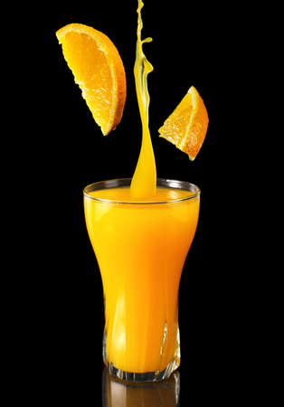 Orange juice promotional concept for restaurants and cafes. Black background. Close upの写真素材