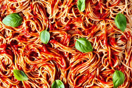 Cooked spaghetti with tomato sauce. Background of pasta close up. Food background top viewの写真素材