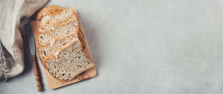 Organic sour dough non-gluten bread on wooden boardの写真素材