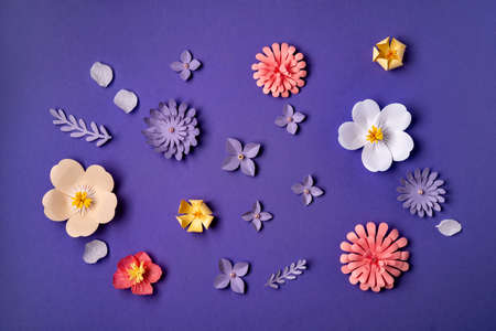 Flower pattern flat lay on trendy violet background. Paper art, handcraft, very peri