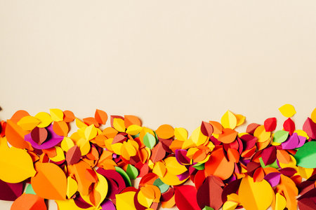 Flat lay of many vibrant autumn leaves made of paper. Hobby and handcrafting. Beautiful Autumn season. Copy spaceの写真素材
