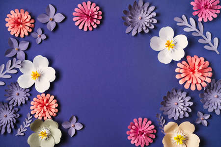 Flower pattern flat lay on trendy violet background. Paper art, handcraft, very peri