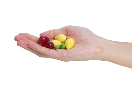 Fresh grapes, ginkgo and peas in hand isolated on white background の写真素材