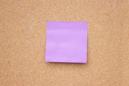 Wooden board with blank sticky note の写真素材