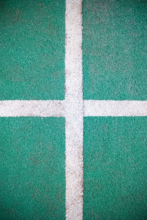 Fake grass and white line as background の写真素材