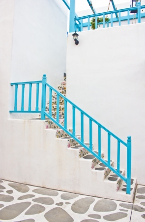 Beautiful ladder with blue handrail の写真素材