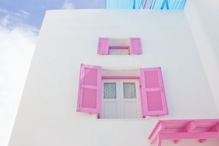 Open pink window with white building のeditorial素材