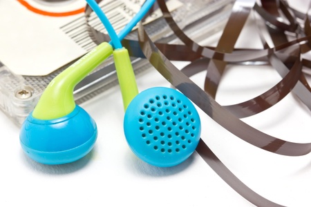 Broken audio cassette  with earphones 