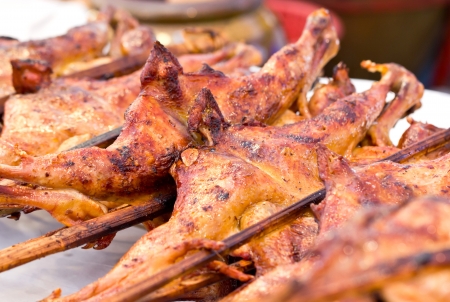 Roasting chicken in market.の写真素材