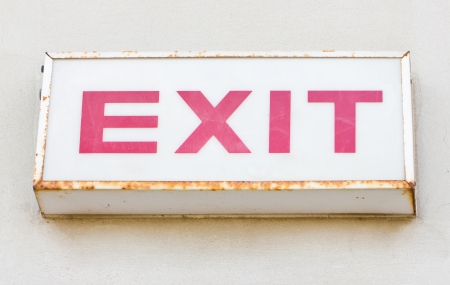 Exit sign on the concrete wall の写真素材