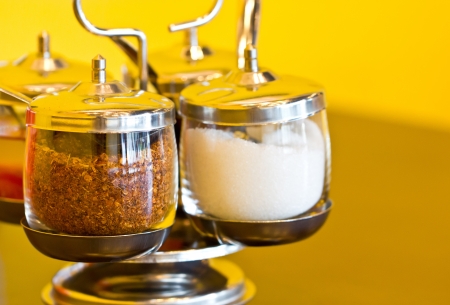 Thai seasoning container include cayenne pepper, sugar, fish sauce and chilies in vinegar の写真素材