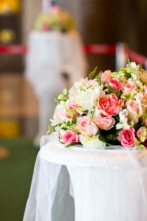 Artificial flowers bunch decorated on table の写真素材